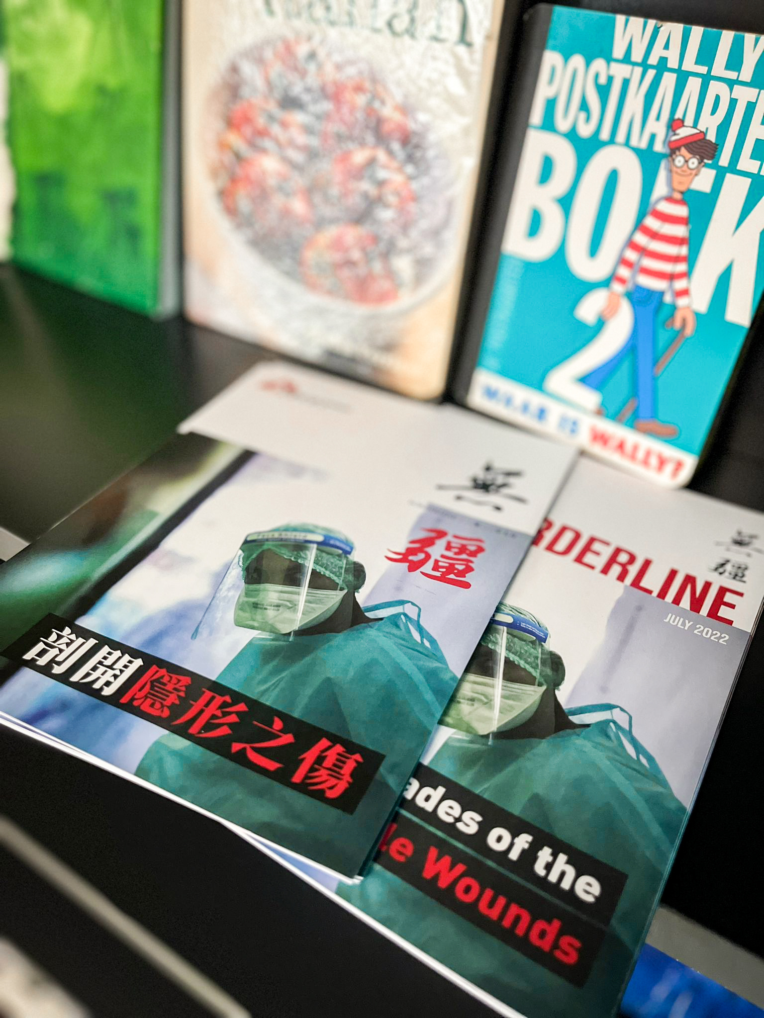 MSF Borderline Magazine on bookshelf at L3 Hot Desk Area