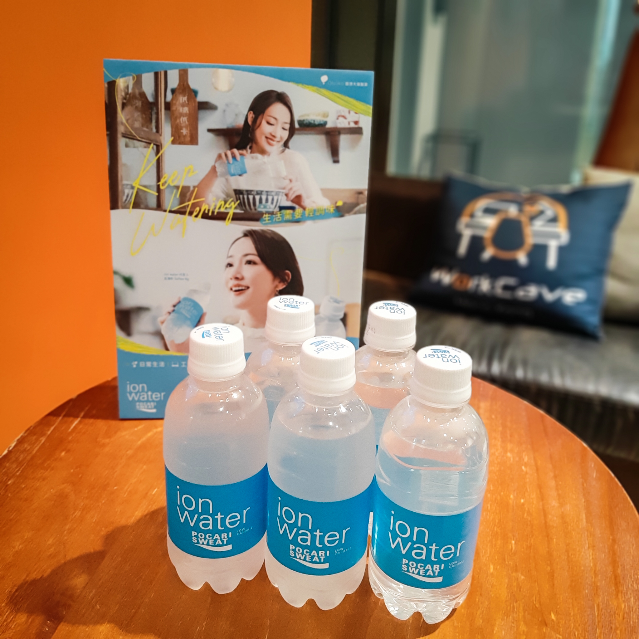 5 bottles of Pocari Sweat Ion Water in front of the promotion foamboard, all placed on the coffee table on L1