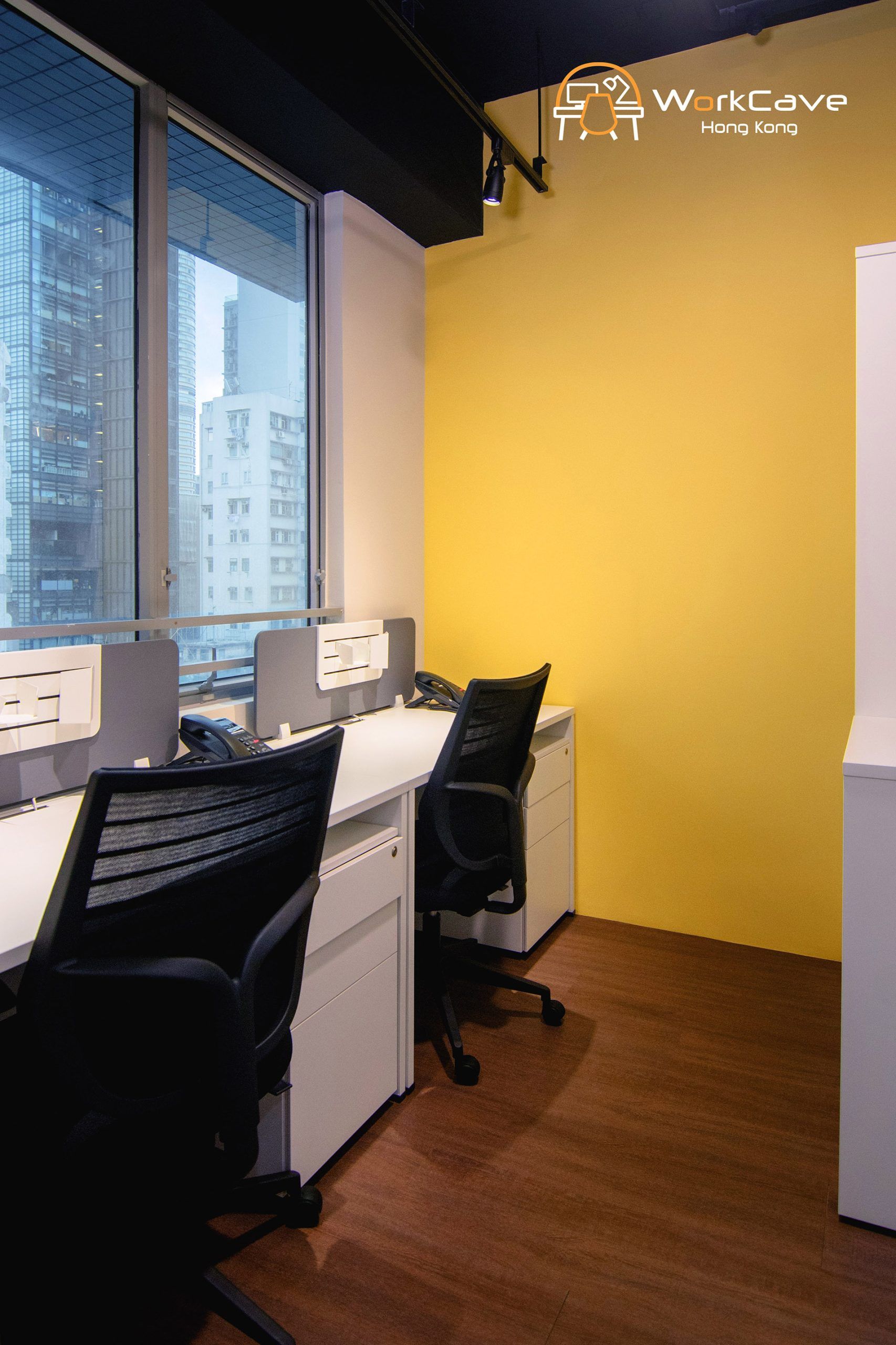WorkCave 2-pax office, city view, tables and chairs facing the openable window